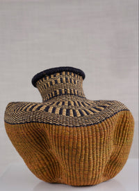 Woven basket with a lid on a white background