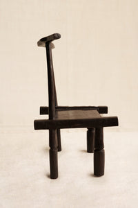 Wooden chair with a minimalist design on a light background