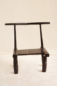 Black wooden chair on a beige background