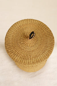 View of the top of a Woven basket on a beige background
