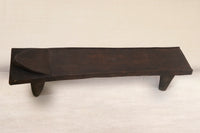 Wooden Senufo bed on a white background